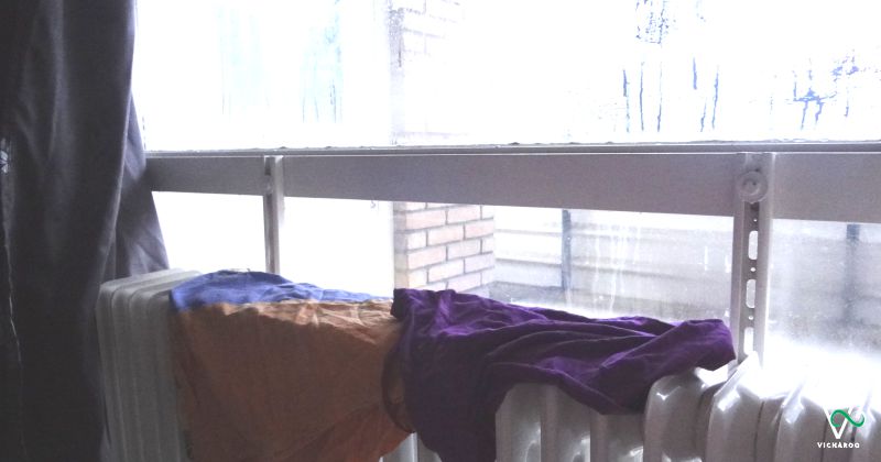 Condensation on the glass window due to drying my clothes on a heater | Vicharoo