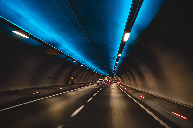 Photocatalytic cement-based paint is used to coat the inner walls of the tunnels